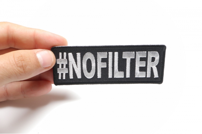Hashtag No Filter Funny Iron on Patch shown on hand for size comparison