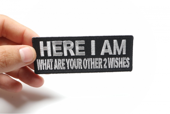 Here I Am Other 2 Wishes Funny Iron on Patch shown on hand for size comparison
