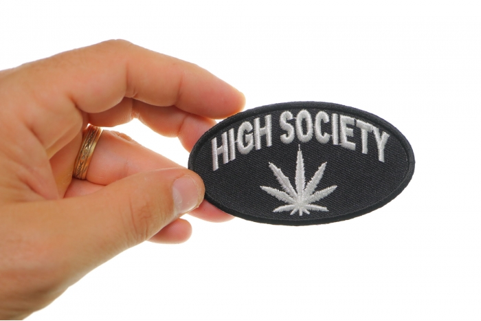 High Society Funny Iron on Patch shown on hand for size comparison