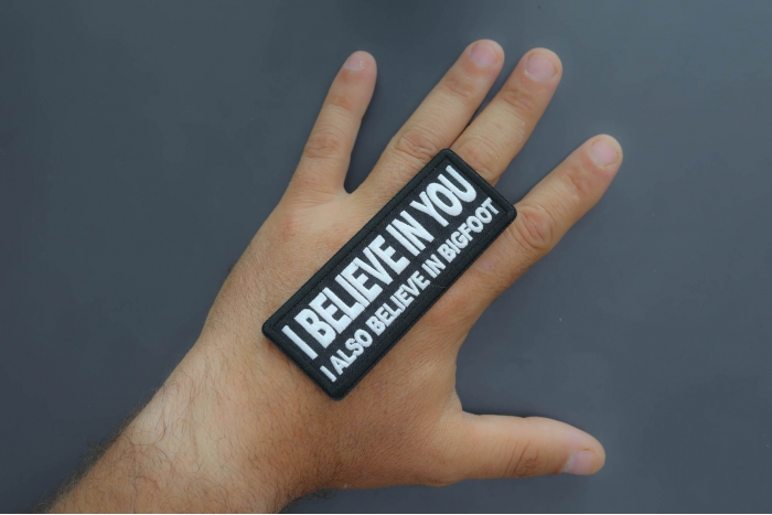 I believe in you I also believe in bigfoot Patch shown on hand for size comparison
