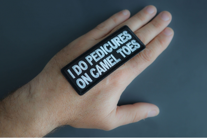 I Do Pedicures On Camel Toes Patch shown on hand for size comparison