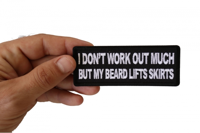 I don't Work out much But My Beard Lifts Skirts Funny Iron on Patch shown on hand for size comparison