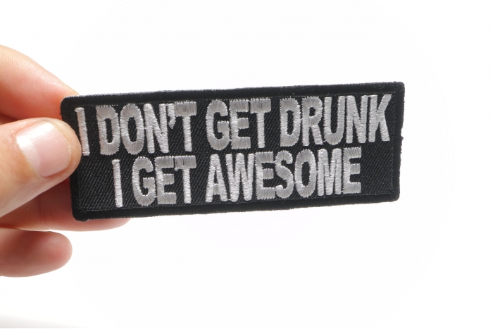 I Don't Get Drunk I Get Awesome Funny Saying Patch shown on hand for size comparison