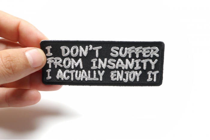 I Don't Suffer From Insanity I Actually Enjoy It Funny Iron on Patch shown on hand for size comparison