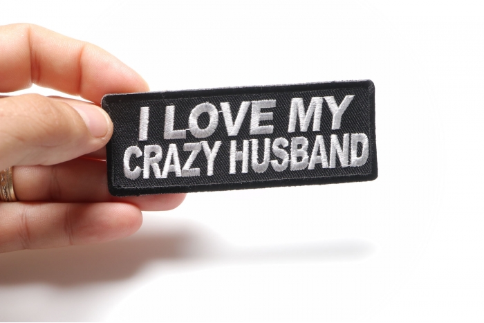 I Love My Crazy Husband Funny Iron on Patch shown on hand for size comparison