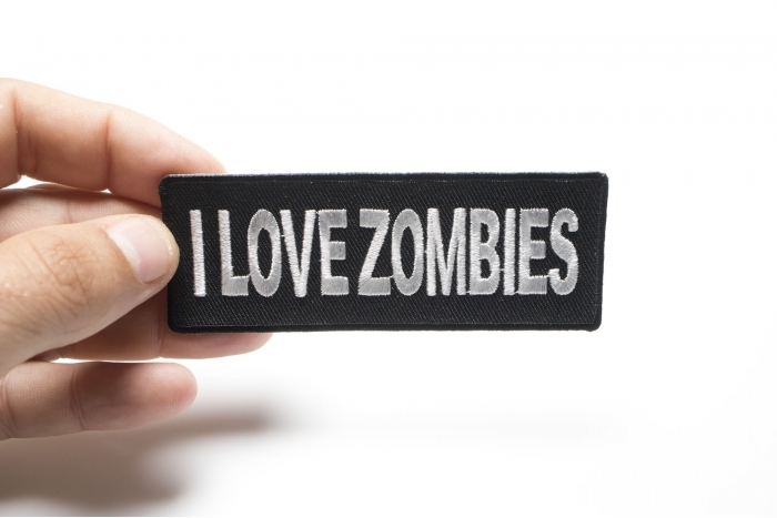 I Love Zombies Funny Iron on Patch shown on hand for size comparison