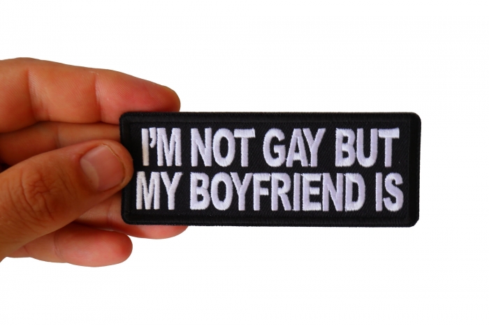 I'm Not Gay but My Boyfriend Is Funny Iron on Patch shown on hand for size comparison