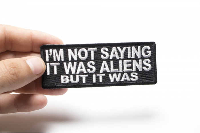 I'm Not Saying It Was Aliens But It Was Funny Iron on Patch shown on hand for size comparison
