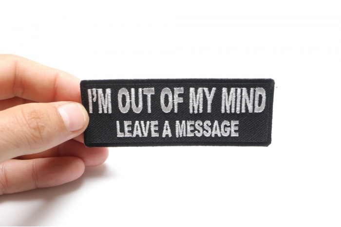 I'm Out Of My Mind Leave A Message Funny Iron on Patch shown on hand for size comparison
