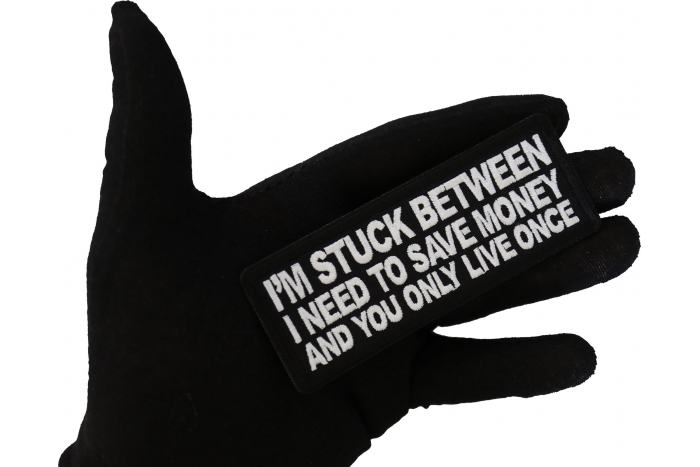 I'm stuck between I need to save money and you only live once Funny Iron on Patch shown on hand for size comparison