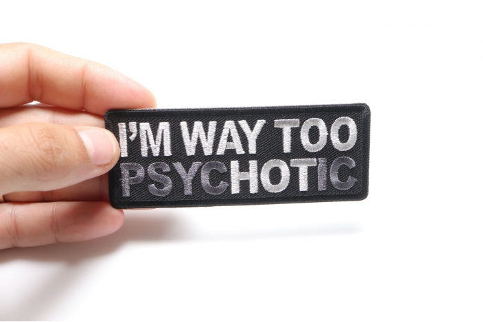 I'm Way too Psychotic Funny Iron on Patch shown on hand for size comparison