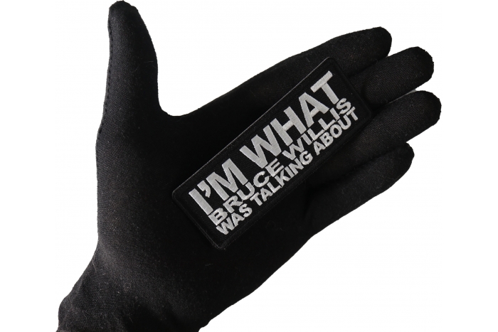 I'm What Bruce Willis Was Talking About Funny Iron on Patch shown on hand for size comparison