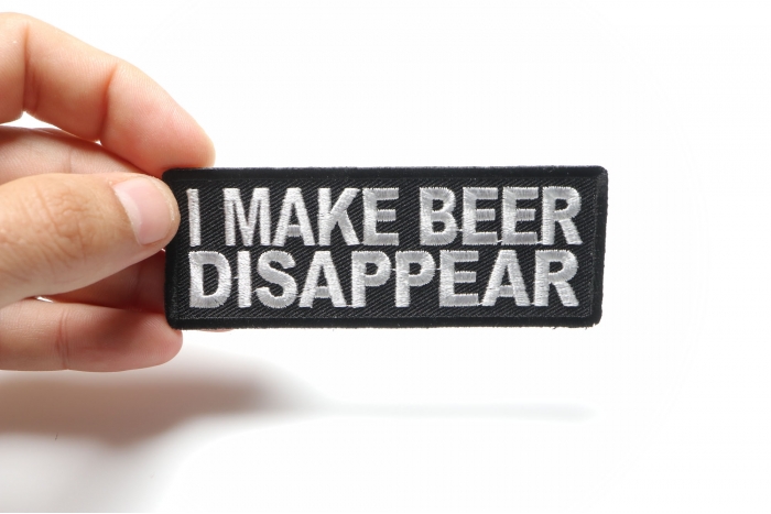 I Make Beer Disappear Funny Iron on Patch shown on hand for size comparison