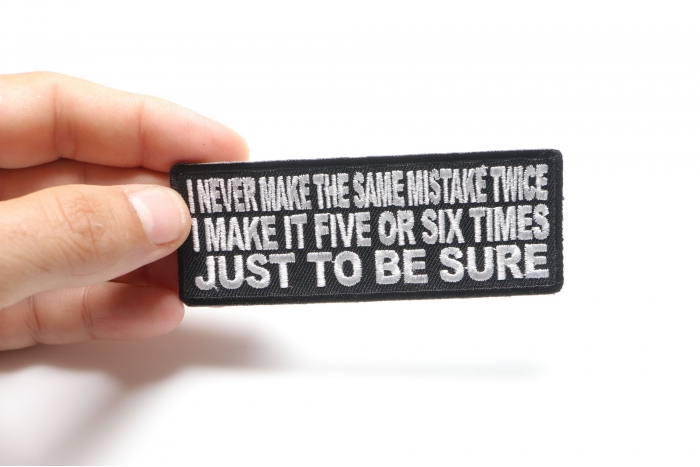 I Never Make The Same Mistake Twice I Make It Five or Six Times Funny Iron on Patch shown on hand for size comparison
