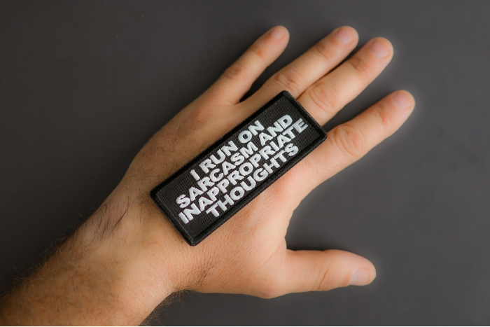 I Run On Sarcasm And Inappropriate Thoughts Patch shown on hand for size comparison