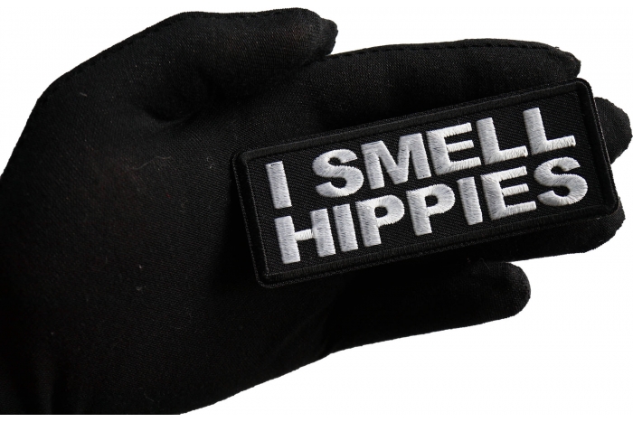 I Smell Hippies Patch shown on hand for size comparison