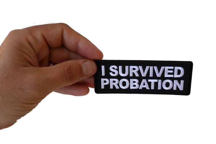 I survived Probation Funny Iron on Patch shown on hand for size comparison