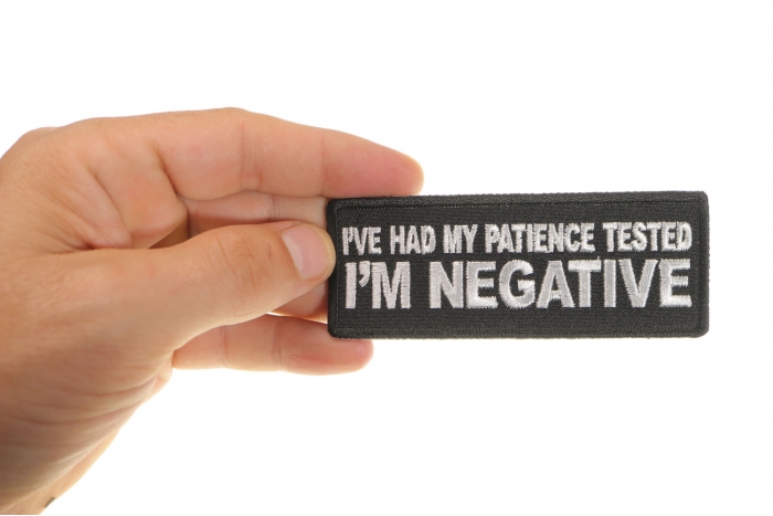 I've Had My Patience Tested I'm Negative Funny Iron on Patch shown on hand for size comparison