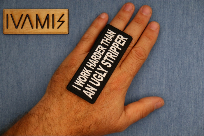 I Work Harder than an Ugly Stripper Patch shown on hand for size comparison