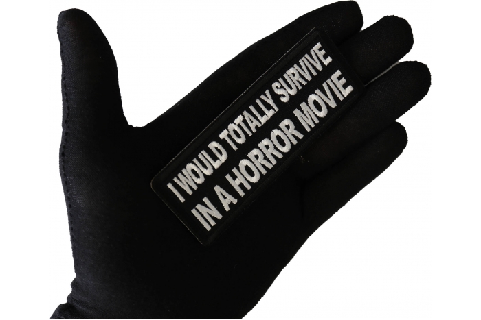 I Would Totally Survive in a Horror Movie Funny Patch shown on hand for size comparison