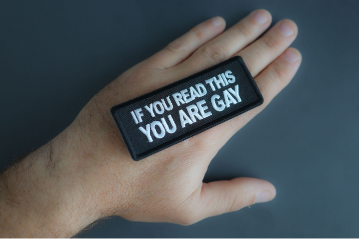 If You Read This You Are Gay Patch shown on hand for size comparison