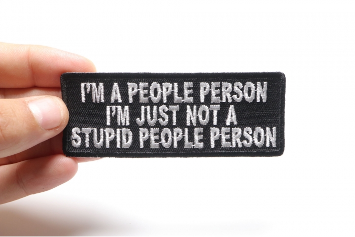 I'm A People Person I'm Just Not A Stupid People Person Funny Iron on Patch shown on hand for size comparison
