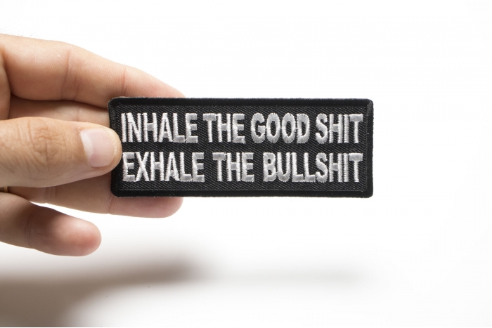 Inhale the Good Shit Exhale The Bullshit Funny Iron on Patch shown on hand for size comparison