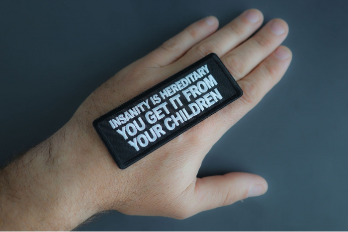Insanity Is Hereditary You Get It From Your Children Patch shown on hand for size comparison