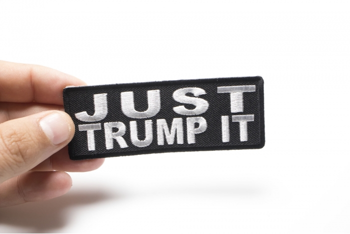 Just Trump It Funny Iron on Patch shown on hand for size comparison
