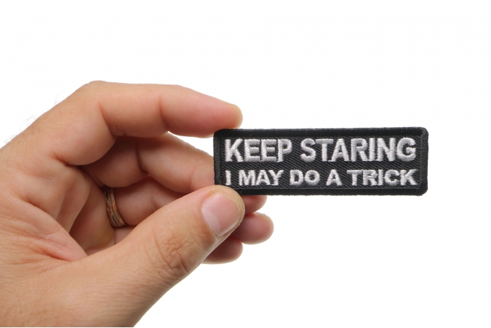 Keep Staring I May Do A Trick Funny Iron on Patch shown on hand for size comparison