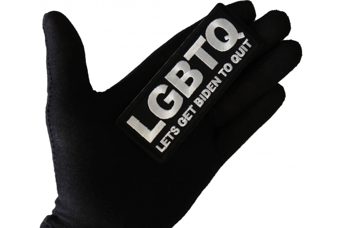 LGBTQ Lets Get Biden to Quit Funny Patch shown on hand for size comparison