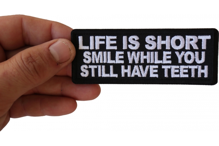 Life is Short Smile While You Still Have Teeth Patch, Funny Saying Patches shown on hand for size comparison