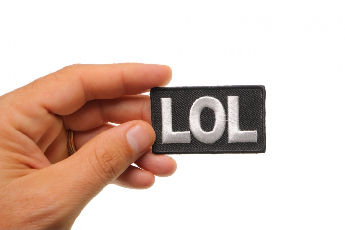 Lol Funny Iron on Patch shown on hand for size comparison