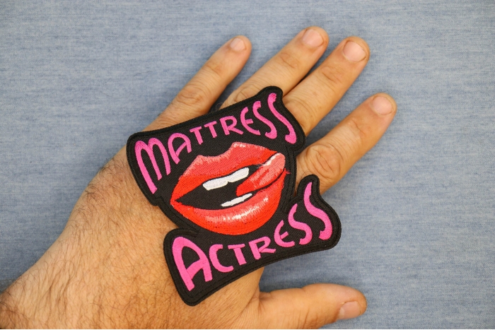 Mattress Actress Patch shown on hand for size comparison