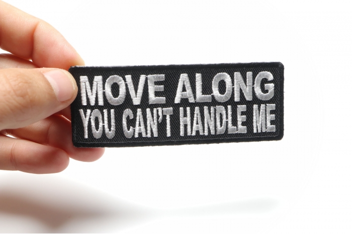 Move Along You Can't Handle Me Funny Iron on Patch shown on hand for size comparison