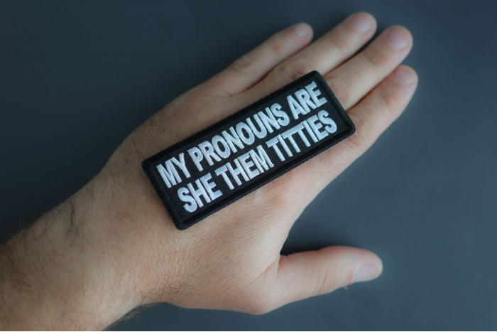 My Pronouns Are She Them Titties Patch shown on hand for size comparison