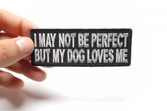 I May Not Be Perfect But My Dog Loves Me Cute Funny Iron on Patch shown on hand for size comparison