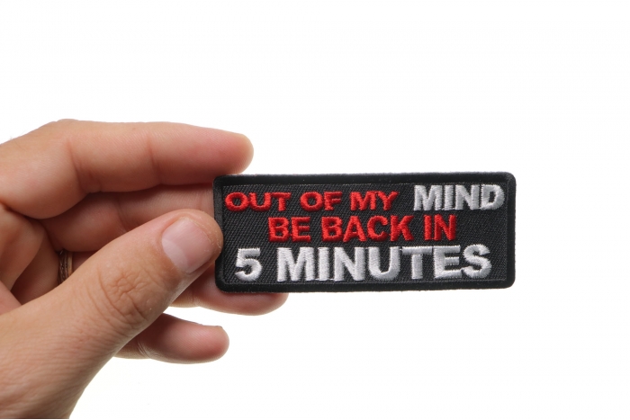 Out Of My Mind Back In 5 Funny Iron on Patch shown on hand for size comparison