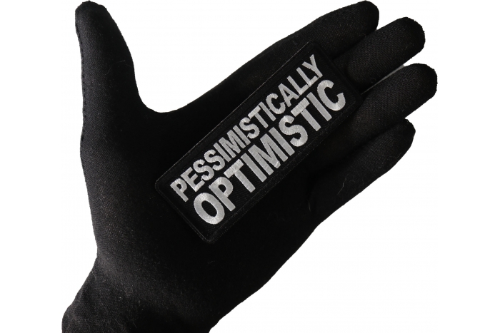 Pessimistically Optimistic Funny Iron on Patch shown on hand for size comparison