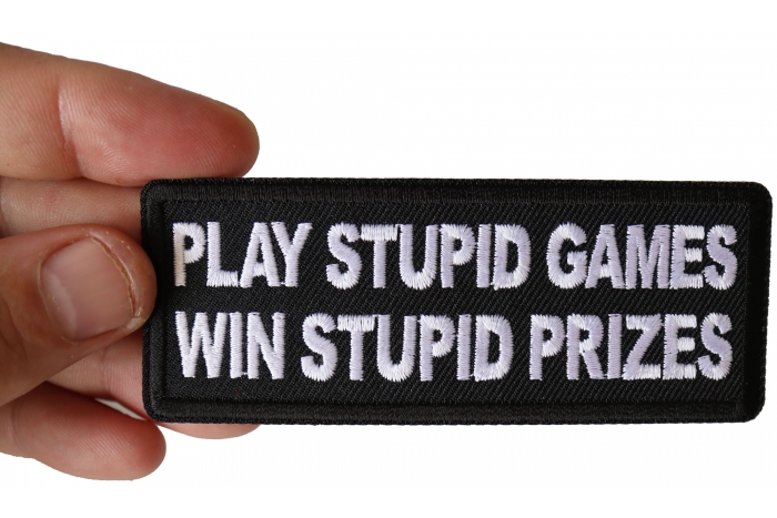 Play Stupid Games Win Stupid Prizes Funny Iron on Patch shown on hand for size comparison