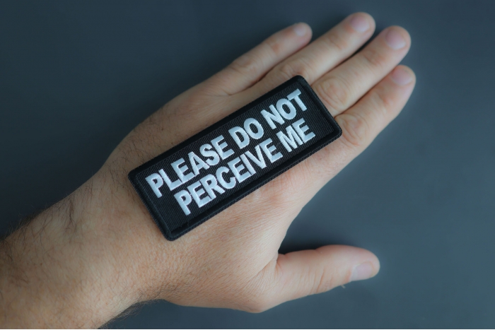 Please Do Not Perceive Me Patch shown on hand for size comparison
