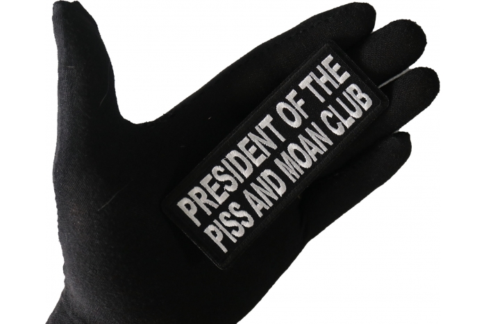 President of The Piss and Moan Club Patch, Funny Saying Patches shown on hand for size comparison