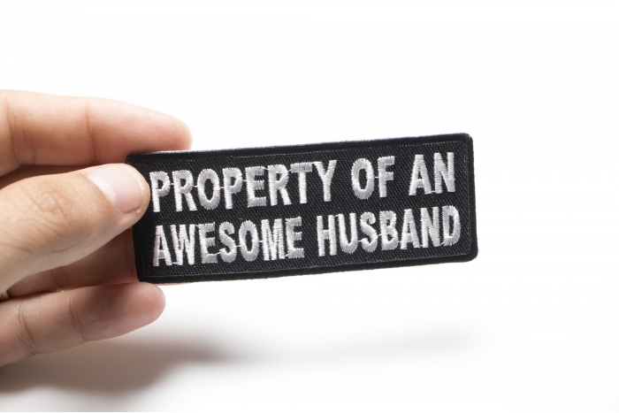 Property Of An Awesome Husband Patch, Funny Saying Patches shown on hand for size comparison