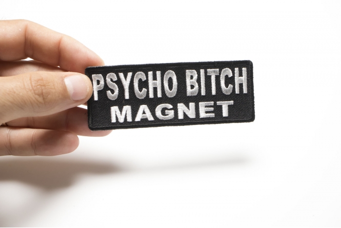 Psycho Bitch Magnet Funny Iron on Patch shown on hand for size comparison