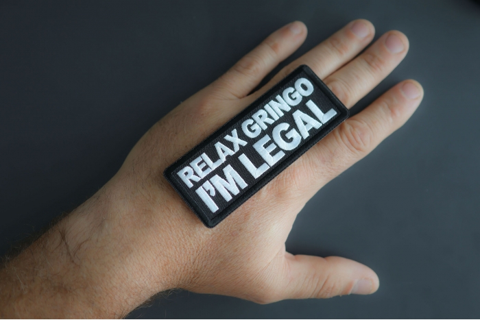 Relax Gringo I'm Legal Patch shown on hand for size comparison