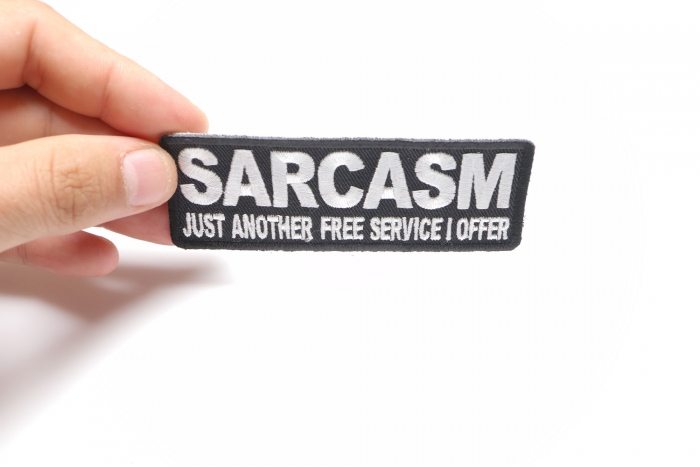 Sarcasm Just Another Service I Offer Funny Iron on Patch shown on hand for size comparison