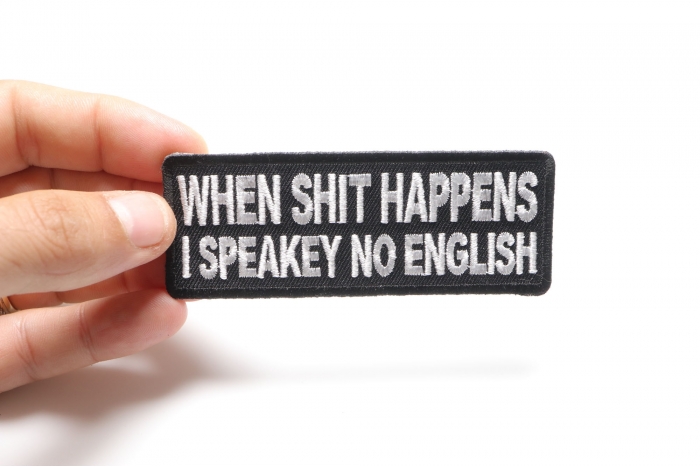 When Shit Happens I Speak No English Funny Iron on Patch shown on hand for size comparison