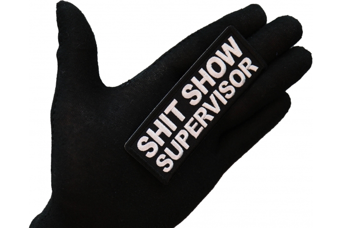 Shit Show Supervisor Patch shown on hand for size comparison
