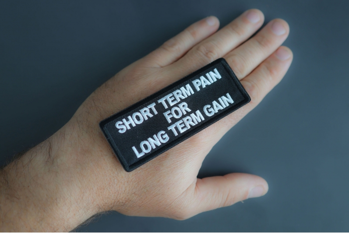 Short Term Pain For Long Term Gain Patch shown on hand for size comparison