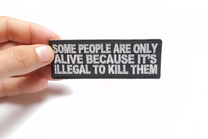 Some People Are Only Alive Funny Iron on Patch shown on hand for size comparison